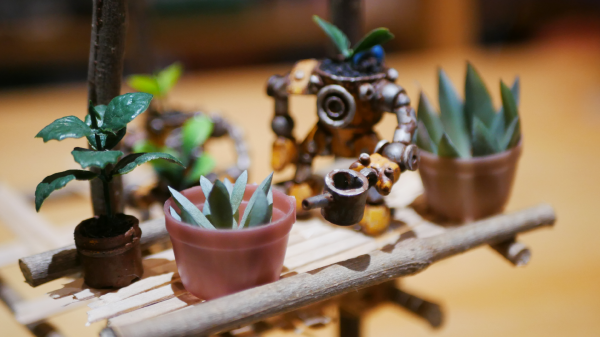 Several robots stand on a miniature wooden balcony and take care of plants in pots