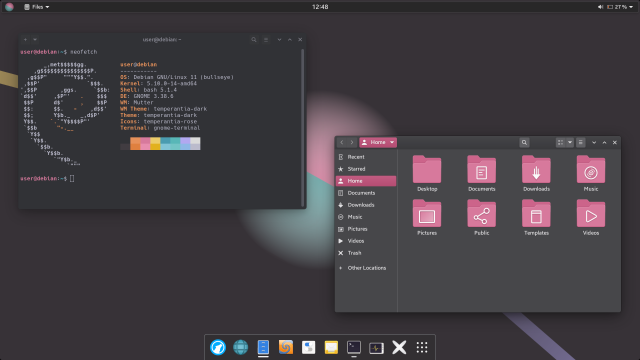 Screenshot of the GNOME desktop environment (v. 3.38), using a custom dark theme, with two windows open - GNOME Terminal and Nautilus. At the bottom is a dock (Dash to Dock extension).

The wallpaper has a dark purple-gray background color. At its center is a sphere shape in two colors: one half is pink, the other blue-green. Two thick lines stretch diagonally across the screen, behind the sphere - a yellow line toward the top left screen edge, and a violet one toward the bottom right screen edge.

The top panel is floating and has a dark gray background color. The "Activities" button is replaced by an icon - the same kind of sphere shape as the one on the wallpaper. The dock is colored using the same dark gray background color as the top panel.

The terminal window is placed at the top left half of the screen. Its corners are slightly rounded, and it has a deep, dark blue-gray background color. Foreground elements are mostly bright blue-gray, but also bright pink and orange.

The Nautilus window shows the home directory. The accent color is pink, as are the folder icons. The window's background color is a mid-dark gray color, and the headerbar has a slight gradient.