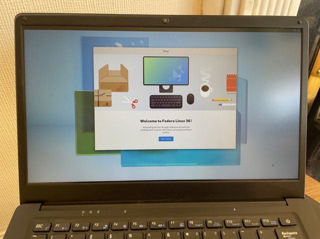 Photo of PinebookPro laptop running Fedora Silverblue 36.