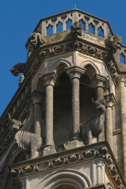 Tower with several bug-eyed oxen and demon toads above