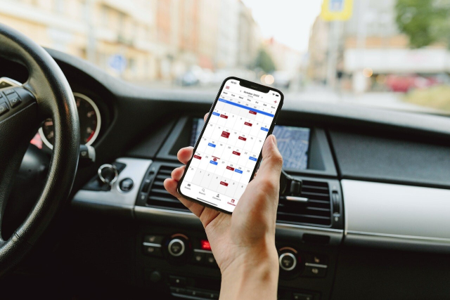 The Tutanota calendar on an iPhone used by someone on the go.