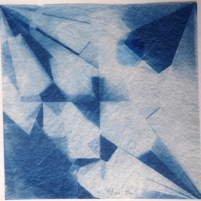 Square image in shades of blue and white, showing a geometric pattern equivalent to the shapes produced in a square of paper after being folded into an origami crane and then opened. The folds define triangles, diamonds and other shapes. Some areas are dark blue, some white, some tones of blue. In each one, the shapes are the same, but the blue and white is different.