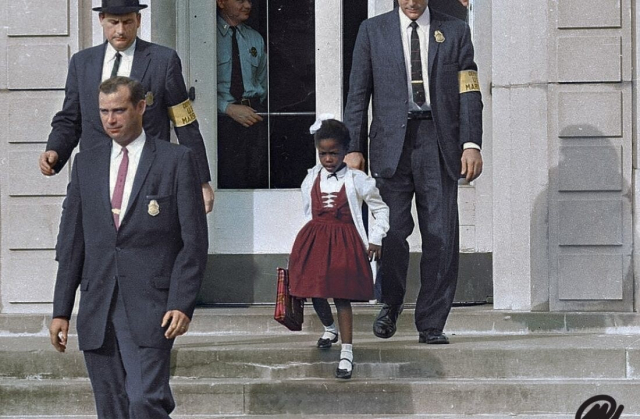 Ruby Bridges at 6, being escorted to school by US Marshals 
