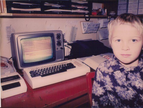 Vidar in front of a Vic-20 with a CRT displaying an American flag, from about 1980 or 1981
