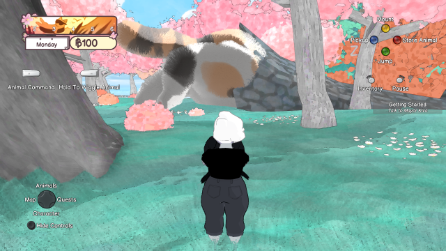 A figure all in black holding a crow stares at a giant calico cat butt sticking out of a huge tree log.