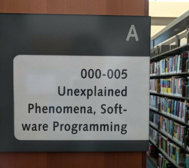A panel in a library.

A
000-005
Unexplained Phenomena, Software Programming