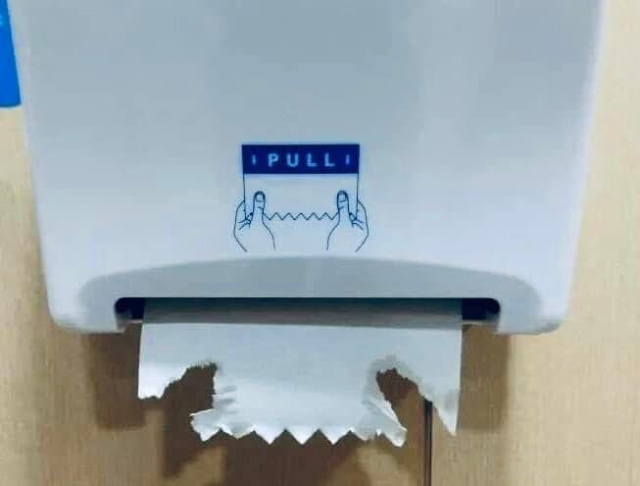 Paper dispenser. Small pieces torn off with wet hands