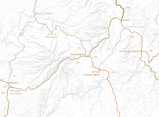 An excerpt of a railway map, centering on the station of Neussargues. The altitude relief shows a lot of mountains, a very distinct range radiates out from a central point just west of Neussargues.