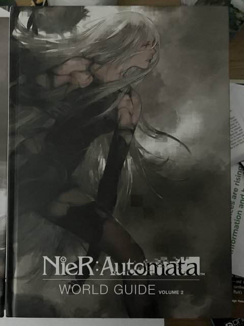 The cover of the second volume of Nier:Automata World Guide, showing A2