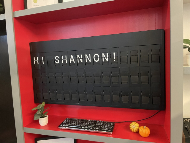 A split flap display that reads “Hello Shannon!”