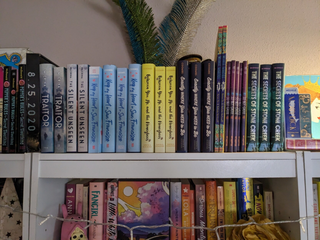 Bookshelf photo with my currently published titles