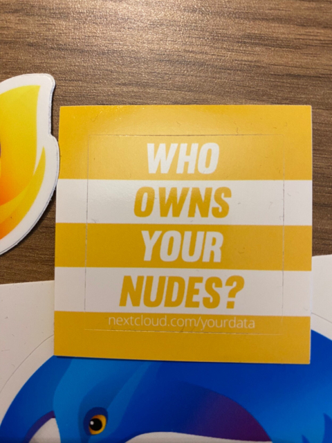 A sticker that says “who owns your nudes?“