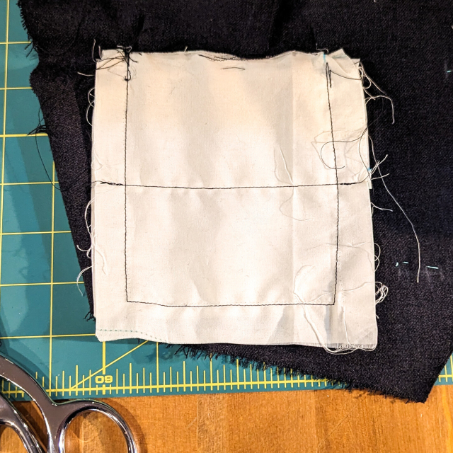 The pocket bag has been stitched back together, with the patch pocket sandwiched between the layers. This new stitching forms the side seam of both pockets.
