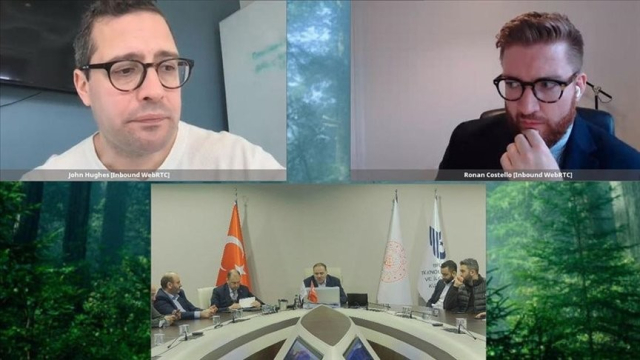 A screenshot from a videoconference, split into three squares. In the top two squares two man from Twitter is seen, at the bottom bunch of Turkish government officials sitting on a long desk. 
