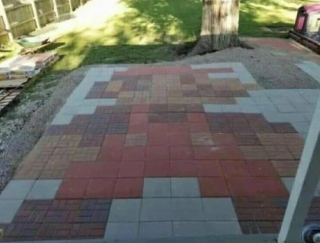 Patio stones laid out to form image of Nintendo’s Mario character. 