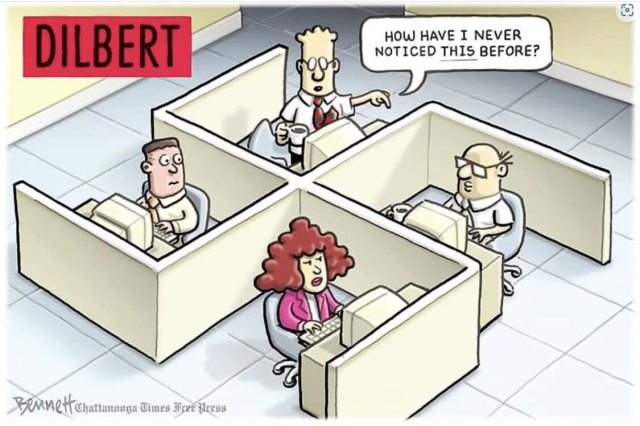 Dilbert characters with desks laid out in swastika format