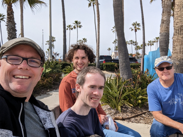 Photo of the team {Quentin, Sean, Mick and James) at Newport Beach on Saturday
