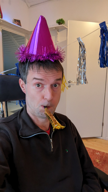 Daniel with party hat 