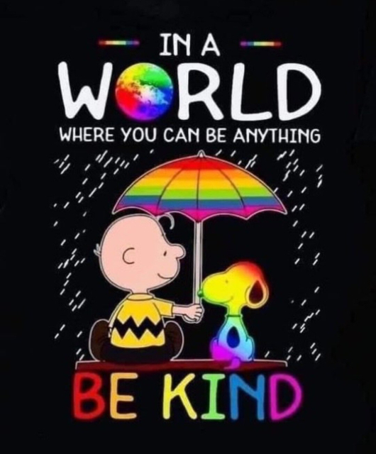 Charlie Brown and Snoopy sitting under a rainbow umbrella with the text, "In a world where you can be anything, be kind."