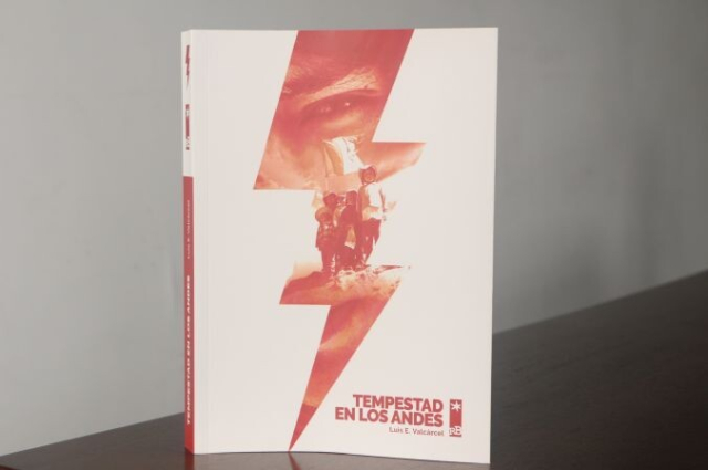 "Tempestad en los andes" book by Luis E. Valcárcel. White and Red book standing on a brown table in front of a white background.