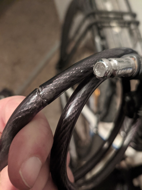 A partly cut bike lock chain