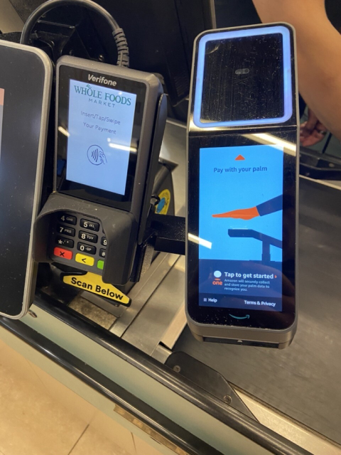 photo of Whole Foods new biometric hand scanner, to allow customers to quickly pay for food... in exchange for their handprint data.