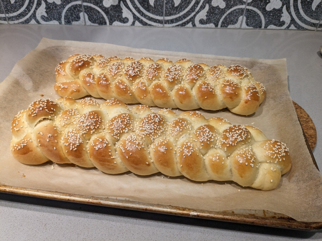 Two challah loaves straight out of the oven.