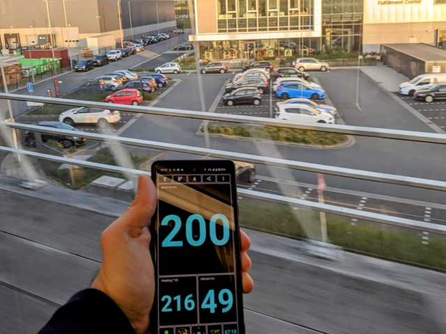 A phone with GPS app on a phone showing current speed of 200 km/h.