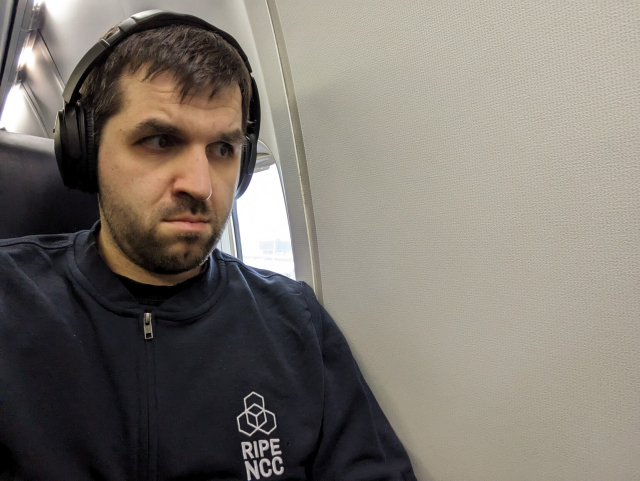 A selfie from a window seat in an aircraft that lacks any window.