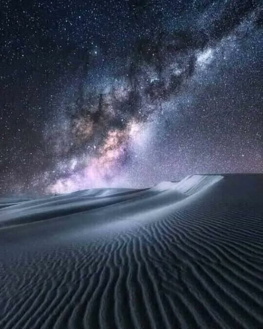 A beautiful photo of the desert lit up by the Milky Way. I wish I had the appropriate words to describe it, but words fail me. 