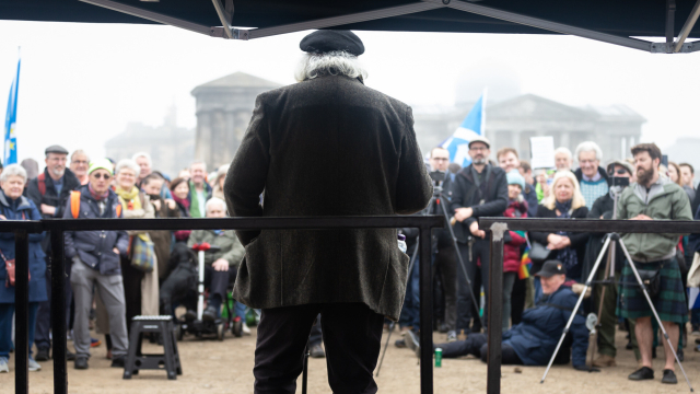 The poet George Gunn, addressing the rally for a republic on Calton Hill, Edinburgh. A crowd looks on with interest.