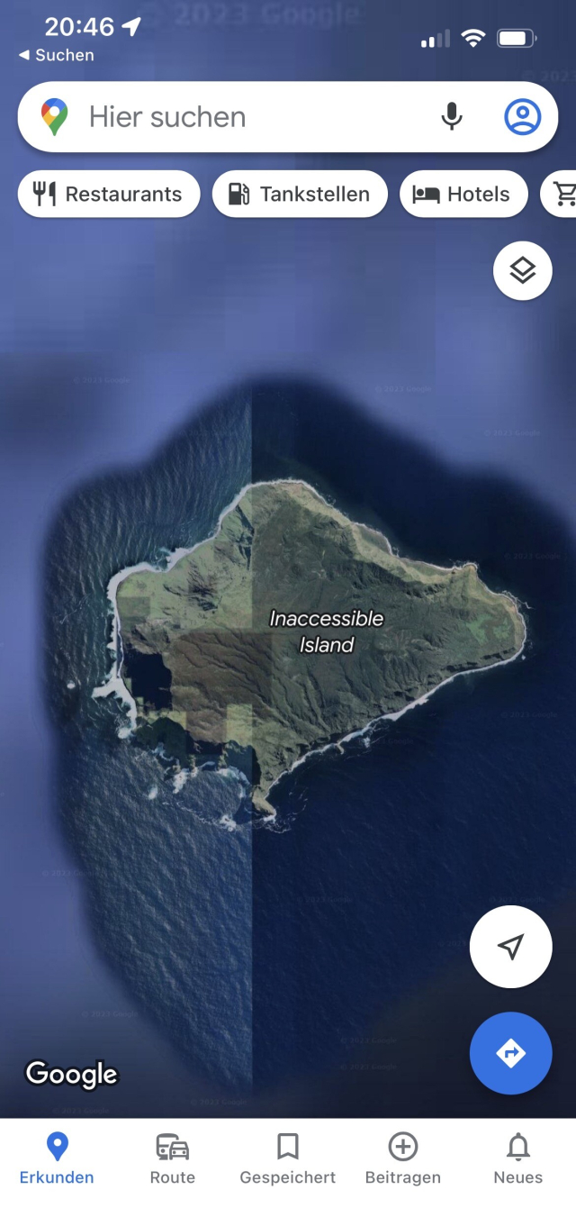 Screenshot of google maps in satellite mode showing a small island in the middle of the ocean, called inaccessible island 