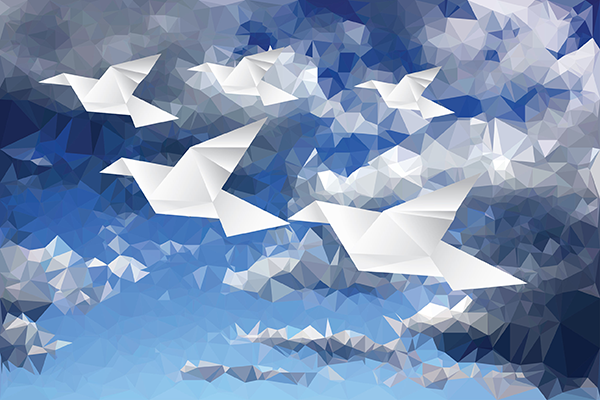 image of birds made of paper with a blue sky background