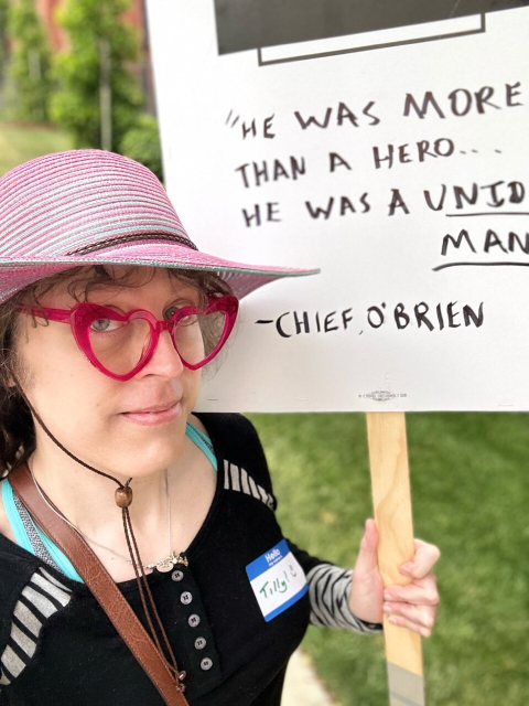 Me picketing with a sign that says, “he was more than a hero… he was a union man.” - Chief O’Brien
