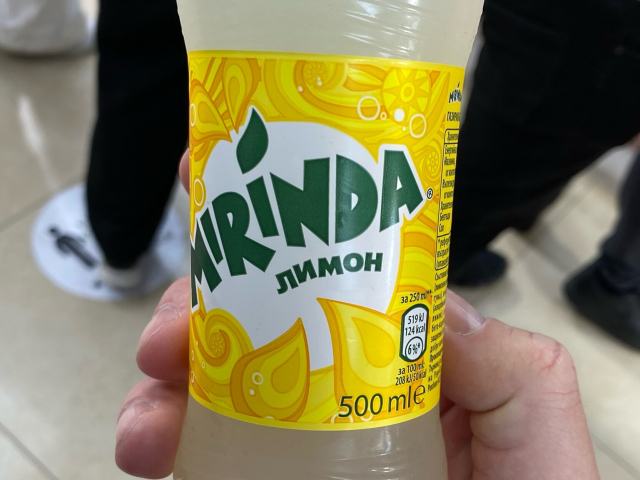 A soft drink bottle labelled “Mirinda лимон.”