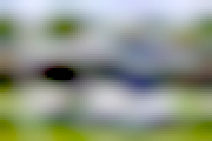 Very short / rectangular Bluebus with one set of doors in the middle. It looks like it's smiling.