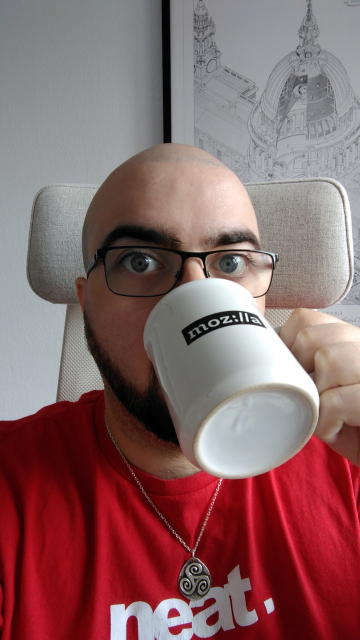Celebratory selfie while drinking from a Mozilla-branded mug