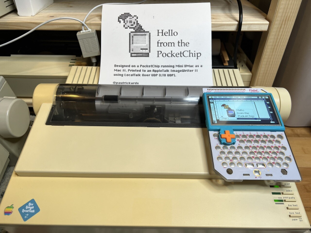A PocketChip showing a document in Quark XPress using the Mini VMac emulator sitting on top of an ImageWriter II printer. The printer has a page coming out that matches the document on the screen. It says Hello from the PocketChip. 