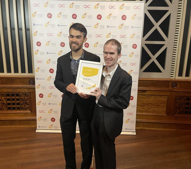 Jamie Teh and Mick Curran holding the QCF Philanthropy Innovation award