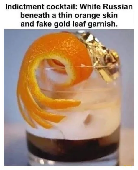 Indictment cocktail: White Russian beneath a thin orange skin and fake gold leaf garnish.