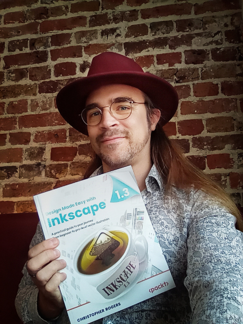 Holding the first printed copy of my book!