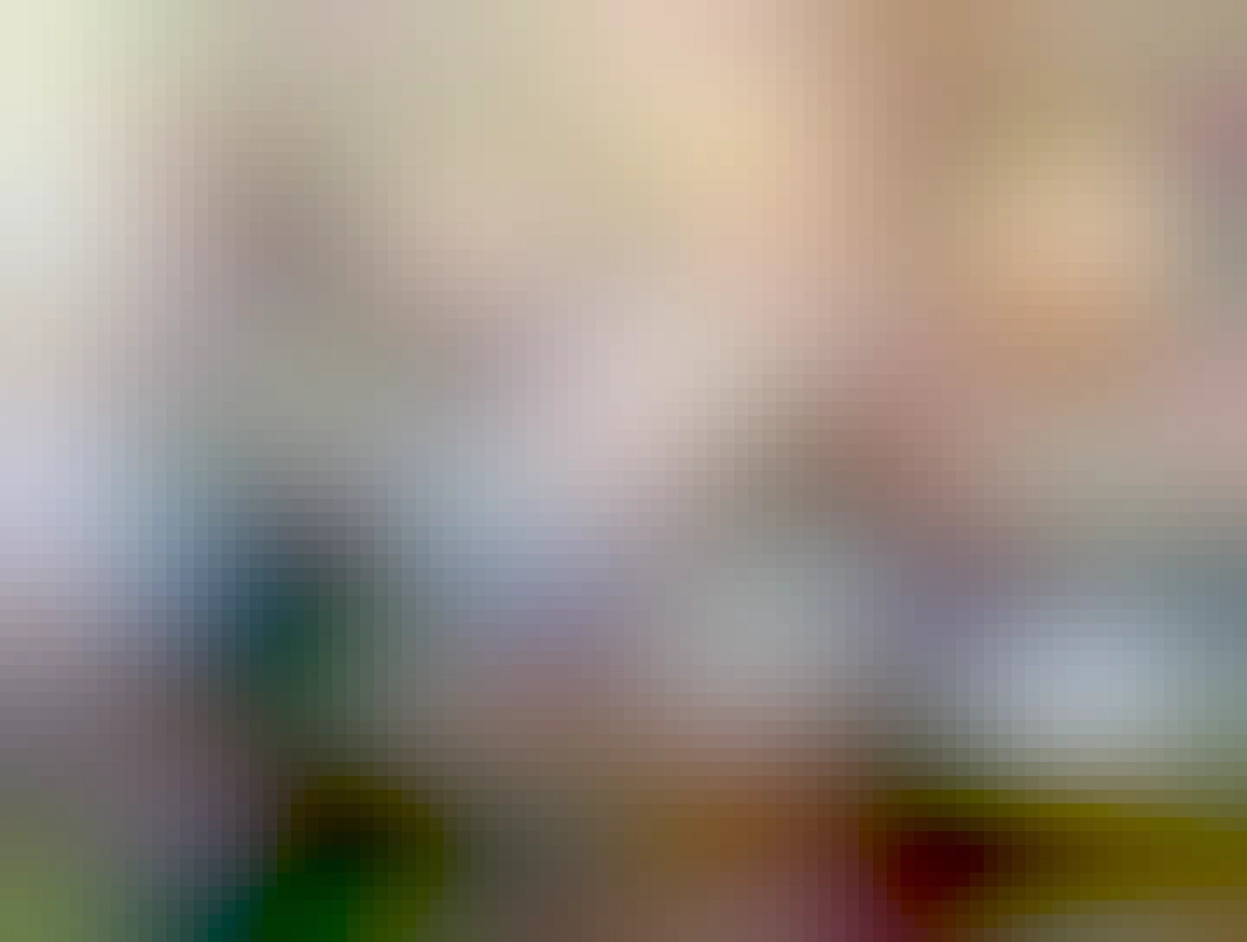 A very old tandem bicycle with an awkward bar connecting the front and back handlebars so that it can also be steered from the back.