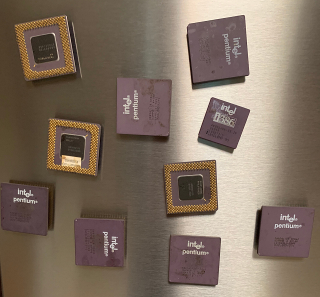 Image of a fridge door with Intel Pentium and 386 processors glued to magnets