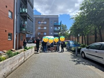 About six anti-fascists blockade an immigration raid van in Peckham, south London.