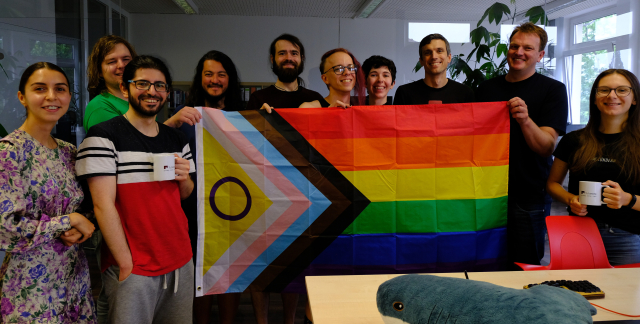 Tutanota team holding a pride flag