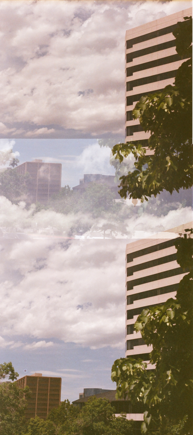 two overlapping identical shots of blue cloudy sky, with large office building partially obscured by a tree to the right