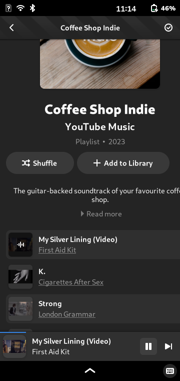 A playlist named "Coffe Shop Indie" by "YouTube Music". The first song is called "My Silver Lining" by First Aid Kit.