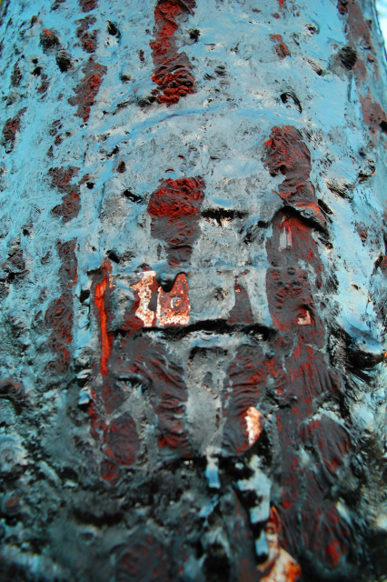 Close up tar on a telephone pole color shifted blue