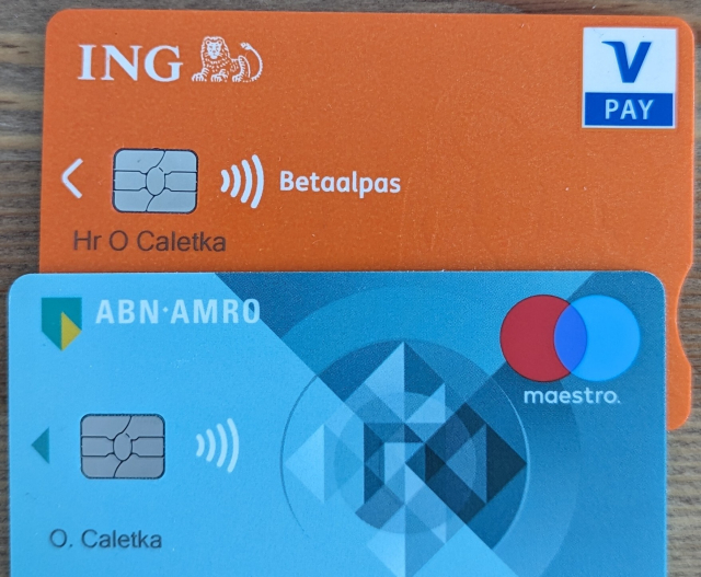 Two payment cards, one from ING branded V-Pay, other from ABN AMRO, branded Maestro