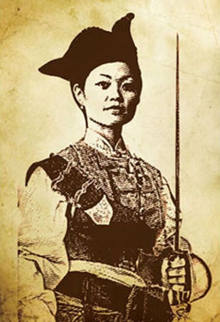 A modern depiction of Ching Shih, a young Asian woman in a slightly altered traditional Caribbean pirate garb, complete with a Chinese version of a tricorn hat; she holds a rapier.